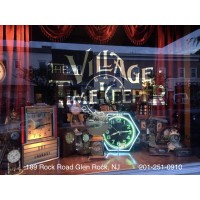 The Village Timekeeper logo, The Village Timekeeper contact details