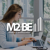 M2be logo, M2be contact details